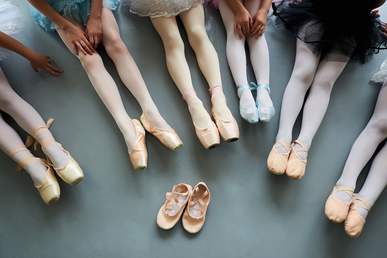 ballet dancers wearing different shoes