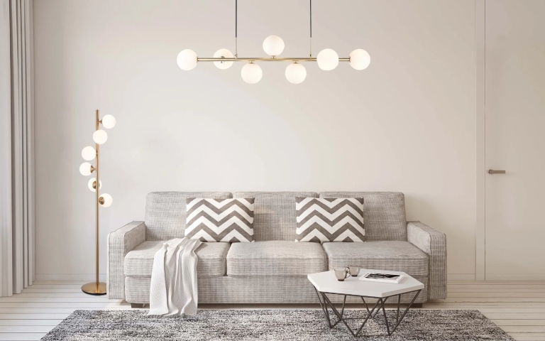 led light globes in a living room with bed and table