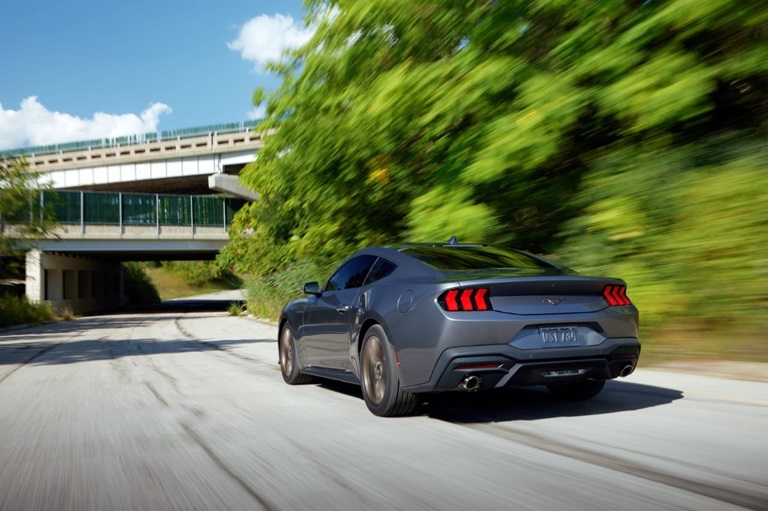 Ford Mustang with aftermarket exhaust on road